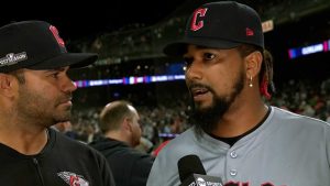 Emmanuel Clase shows off his award during the series against the Yankees