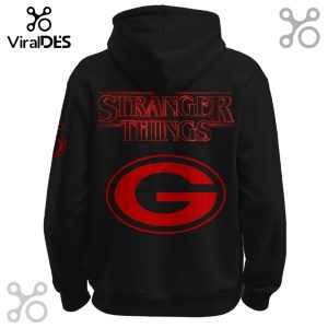Black hoodie back with Stranger Things logo and red Packers emblem.