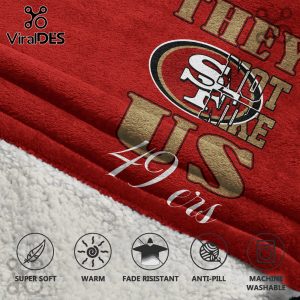 Red blanket with 'They Sleep On Us' text, a 49ers logo and '49ers' text in white cursive.!