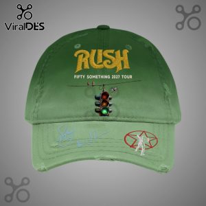 Green hat featuring 'Rush Fifty Something 2027 Tour' text, a traffic light, birds on a wire, signatures, and a starman logo.!