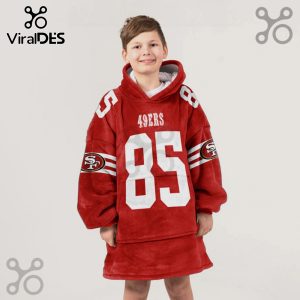 A child wears a red oversized hoodie with '49ers' and the number '85' on it.!