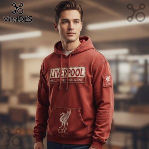 Man wearing red Liverpool hoodie with 'You'll Never Walk Alone' text and bird logo.!