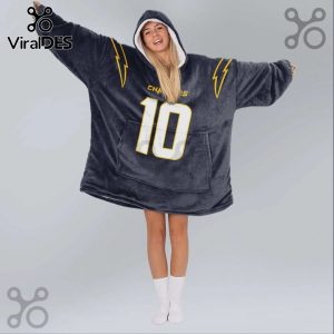 A person wears an oversized hoodie blanket with a sports team logo, lightning bolts, and the number 10.!