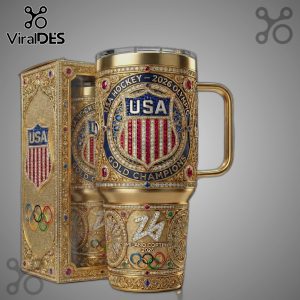 Gold mug and box with USA Hockey 2026 Olympics emblem, featuring 'USA', stripes, and 'Gold Champions' text.!