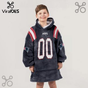 Boy wearing a New England Patriots-themed oversized hoodie blanket with 'Patriots' and the number '00' on it.!