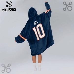 Person wearing a hooded blanket with 'NIX' and the number '10' on the back, styled like a sports jersey.!