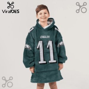 Child wearing a hooded blanket with Eagles logo, jersey number 11, and shoulder stripes design.!