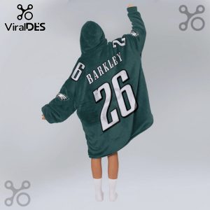 Person wearing a hooded blanket featuring 'BARKLEY 26' on the back and Eagles logo on the sleeves.!