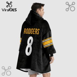 Person wearing a black oversized hoodie with the name RODGERS and number 8 in white on the back. The sleeves have yellow stripes.!