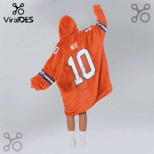 Person wearing an orange Snuggie-style hoodie with the name