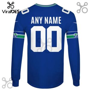 A blue long-sleeve shirt with custom name and number 00 on the back, plus team color accents and seahawk logo.!