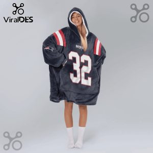 Model wears a gray hoodie blanket with the New England Patriots logo and the number 32 in white.!