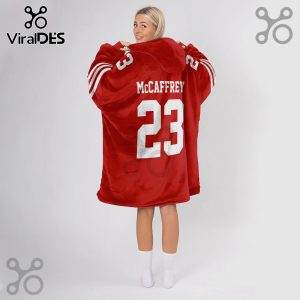 Red oversized hoodie featuring 'McCaffrey' and the number '23' in white on the back!