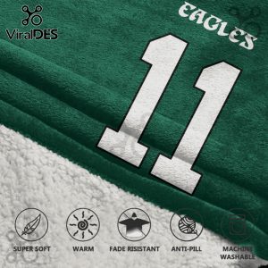 Eagles blanket with the number 11 in white on a green background, with a white sherpa underside.!