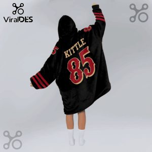 Black hooded blanket featuring 'KITTLE' and the number 85 in gold and red, with stripes on the sleeves.!
