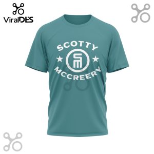 Teal t-shirt with 'Scotty McCreery' text above and below a logo, flanked by stars.!