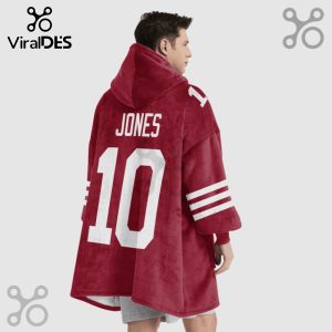 Person wearing a maroon hoodie blanket with 