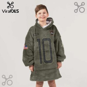 Boy wearing an olive green hoodie blanket with 'Broncos,' the number '10,' an American flag, and a logo.!