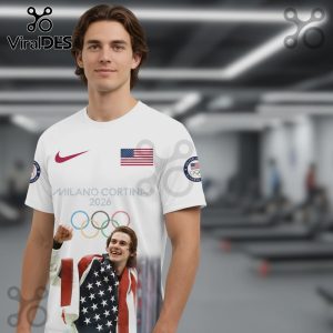 White t-shirt with USA flag, Nike logo, Milano Cortina 2026, Olympic rings, and an image of an athlete with the American flag.!