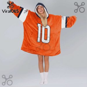 Person wearing an oversized orange hoodie with number 10, team logo on shoulders, on grey background.!