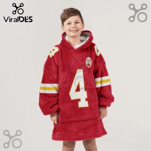 Child wearing a red hooded blanket featuring white and yellow stripes, number 4 and a sports team logo.!