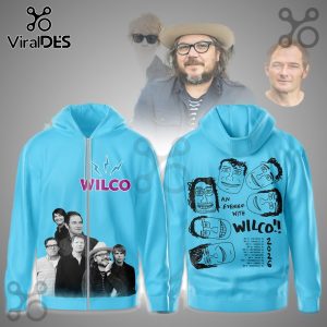 Light blue hoodie with pink Wilco text and band photo on front! Back has cartoon faces, 'An Evening with Wilco!!', and 2026 tour dates!