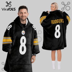 Two people modeling a hooded blanket. The blanket is black with yellow stripes and says 