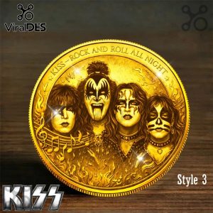 Golden coin design shows the four KISS band members in full makeup above flames and musical notes! Text reads KISS - ROCK AND ROLL ALL NIGHT!