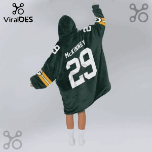 Person wearing hooded blanket with 'MCKINNEY' and '29' on the back, designed like a Green Bay Packers jersey.!