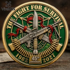 Green/gold coin: THE FIGHT FOR SURVIVAL, 1982, 2027, 45th ANNIVERSARY, guns, knife, ribbon, DE OPPRESSO LIBER!