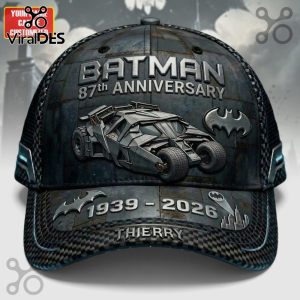 Dark gray cap with Batman, 87th Anniversary, 1939-2026 text! Car and bat logo art!