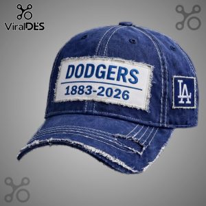 Distressed blue baseball cap with 'Dodgers 1883-2026' patch and 'LA' logo!