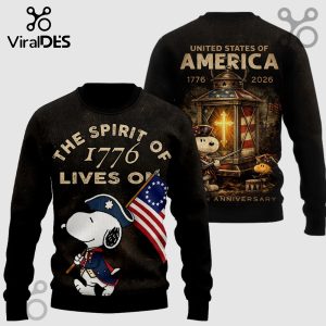 Black sweater featuring Snoopy and Woodstock, 'The Spirit of 1776 Lives On'! Patriotic, cartoon style.!