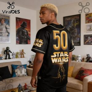Black Star Wars jersey with '50' and character art. Gold font, short sleeves, baseball style. Fan apparel!