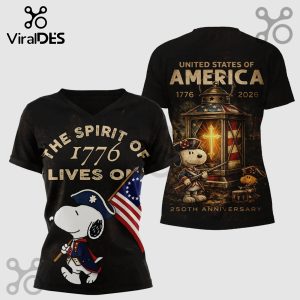 Black tee shows Snoopy & Woodstock as patriots. Text: THE SPIRIT OF 1776 LIVES ON, UNITED STATES OF AMERICA, 250TH ANNIVERSARY.!
