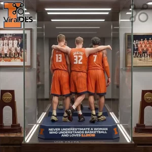 Figurine of Illinois basketball players in orange jerseys with text 'Never Underestimate a Woman Who Understands Basketball and Loves Illinois'!
