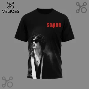 Black t-shirt with red 'SOMBR' star logo and a black and white photo of a man with curly hair and sunglasses!