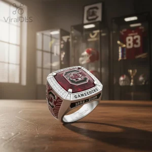 Silver collegiate championship ring with dark red gem, white stones, black accents! Features 