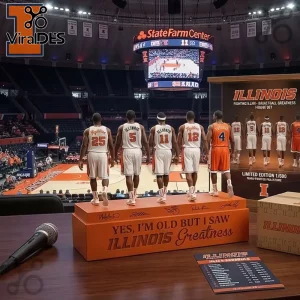 Orange collectible figurine of Illinois basketball players with text 'Yes, I'm Old But I Saw Illinois Greatness'!