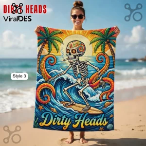 Colorful beach towel with a surfing sugar skull skeleton, octopus tentacles, and text that reads Dirty Heads!