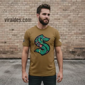 Olive green t-shirt with large floral S logo, featuring green leaves, pink flowers, and yellow details, botanical design!