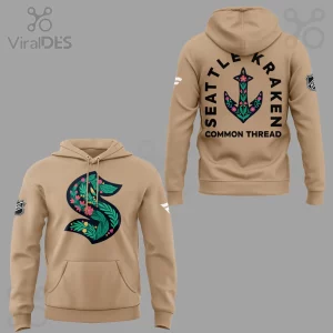 This tan Seattle Kraken hoodie features floral S logo and back graphic with SEATTLE KRAKEN COMMON THREAD text!