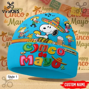Blue custom beanie with Snoopy in a sombrero eating tacos and Peanuts characters playing music for Cinco de Mayo!