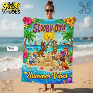 Colorful cartoon Scooby-Doo beach towel with the gang at the beach! Text says 'Scooby-Doo! Summer Vibes' in yellow and purple!