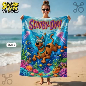 Colorful cartoon beach towel with Scooby-Doo snorkeling in an underwater coral reef scene! Text reads 'SCOOBY-DOO!'!