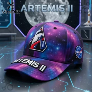 Artemis II mission cap with a purple and blue galaxy print, NASA logo patch, and white text 'ARTEMIS II' on the bill!