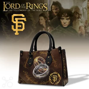 Brown leather-look handbag, black straps! Features a gold SF logo, three metallic rings, Elvish script, and