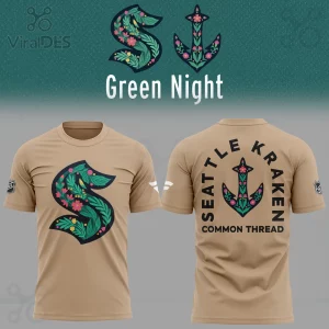 Khaki tee, green floral S logo front, back has floral anchor with SEATTLE KRAKEN COMMON THREAD text, NHL branding sleeve!
