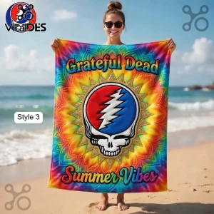 Grateful Dead beach towel with Steal Your Face skull logo on a rainbow tie-dye background with text Grateful Dead Summer Vibes!