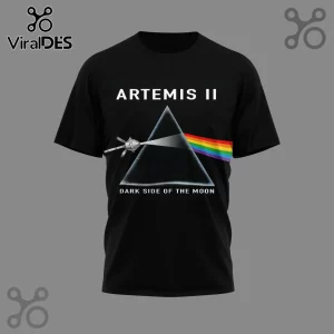 Black t-shirt with Artemis II Dark Side of the Moon text! Prism design with a spacecraft and rainbow! Pink Floyd parody graphic!